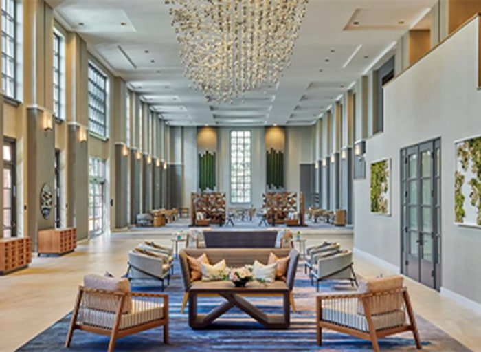 Spacious lobby of the Hyatt Regency La Jolla with tall ceilings and multiple seating areas.